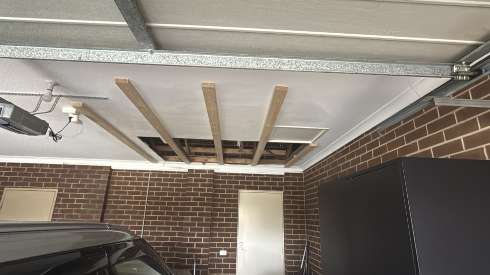 Garage ceiling damaged and deteriorating from water above, found during a defect investigation in Mernda, 20 km from Mickleham